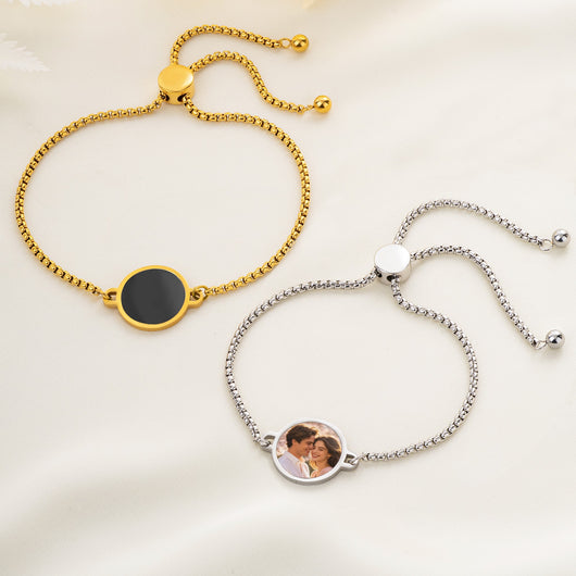 Gold and platinum hidden photo bracelets, one dark and one showing a couple photo