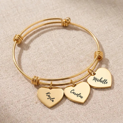 Gold Heartstrings bangle bracelet with 3 engraved heart charms